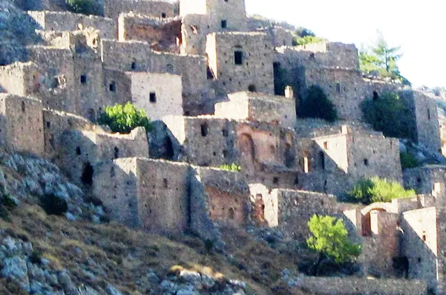 The abandoned stone houses of Anavatos stacked up a cliff on Chios