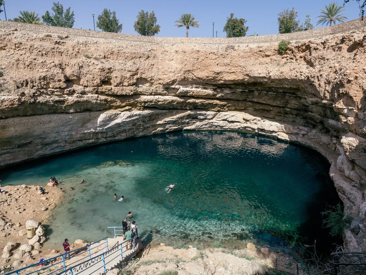 Turquoise water of the Bimmah Sinkhole seen from the rim