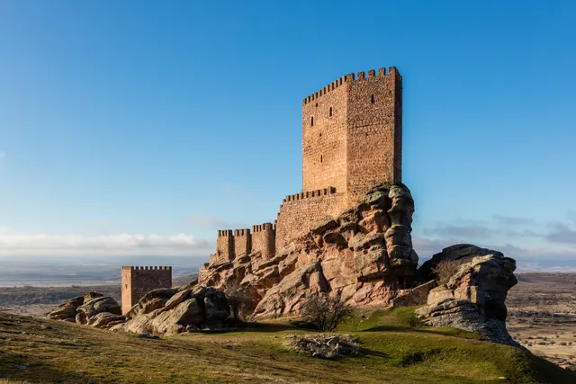 Castillo de Zafra rising from its sandstone outcrop on the Molina plateau